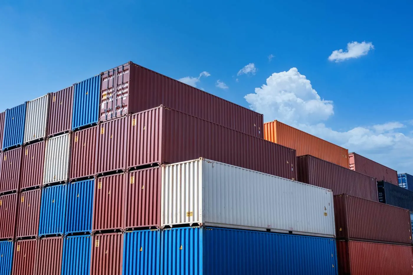 Stacked export shipping containers ready for loading